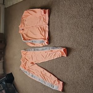 Kappa sweat suit. Peach or hot pink color. The jacket is (2x) and pants (XL)